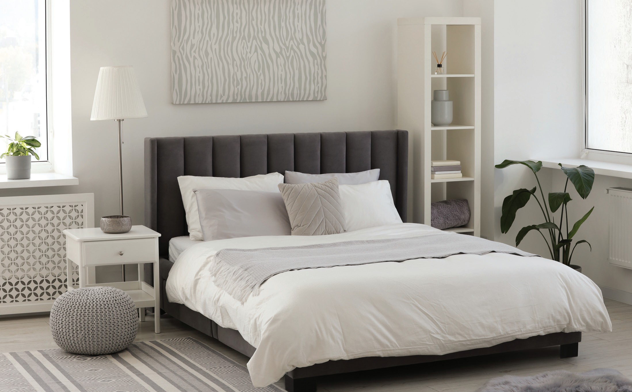 Bright hotel room with sea view and warm timber finishes