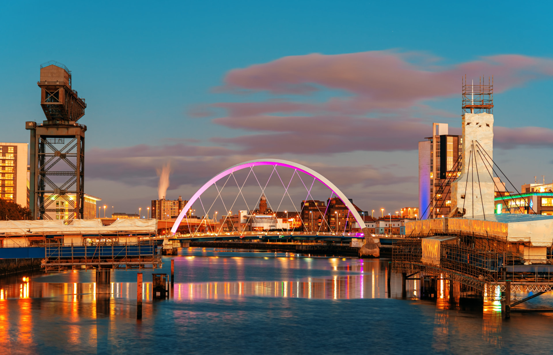 Glasgow cityscape at dusk with the Clyde Arc bridge over the River Clyde