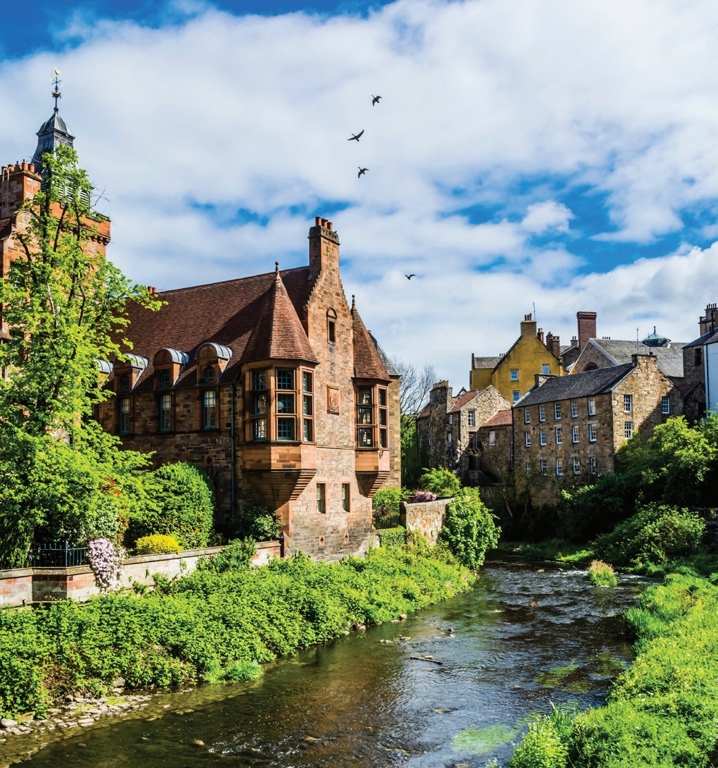 Historic buildings along a river in Glasgow