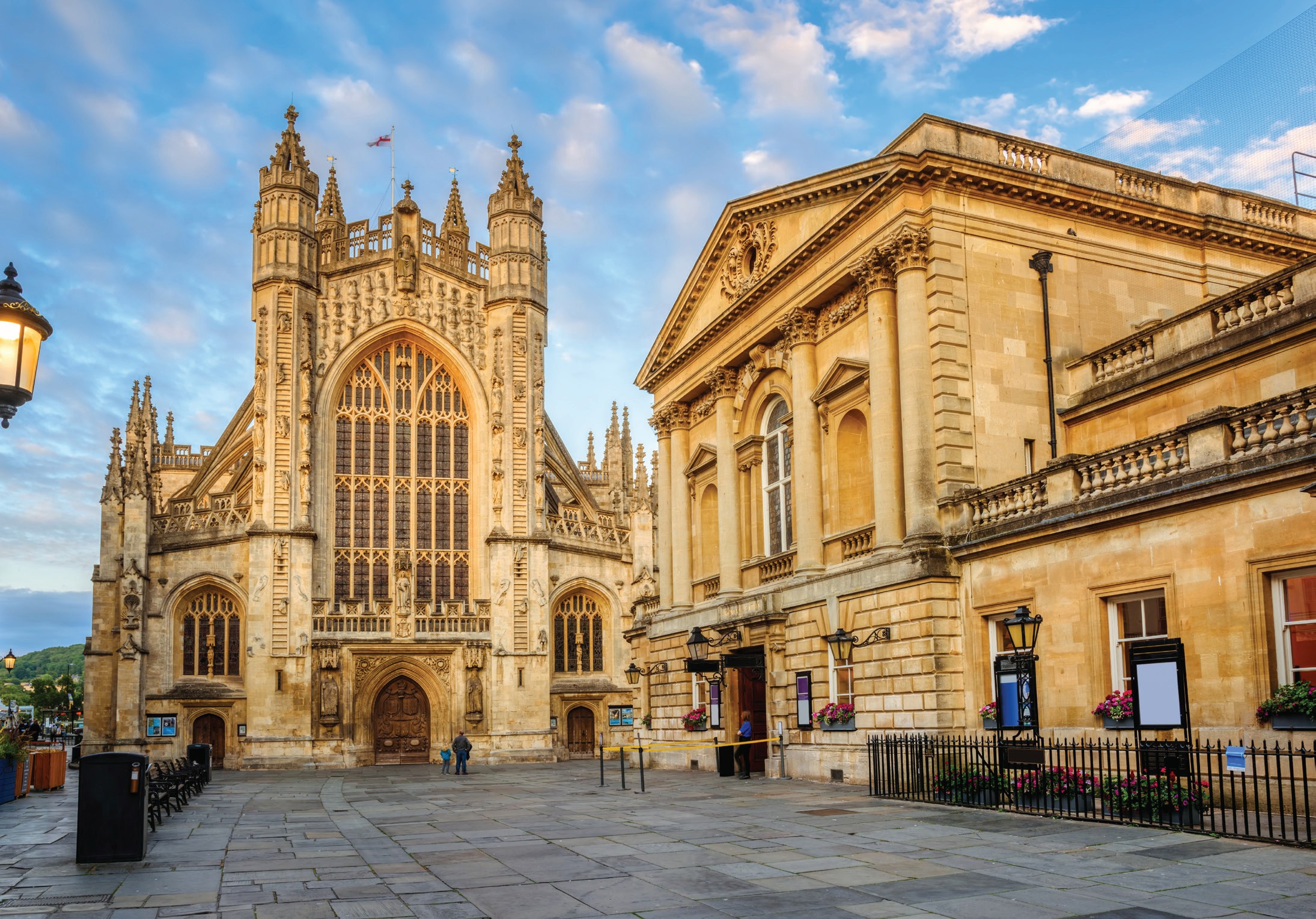 Bath Abbey and the Roman Baths in golden evening light